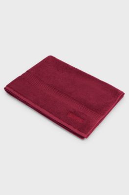 Cotton bath mat with embroidered logo, Dark Red