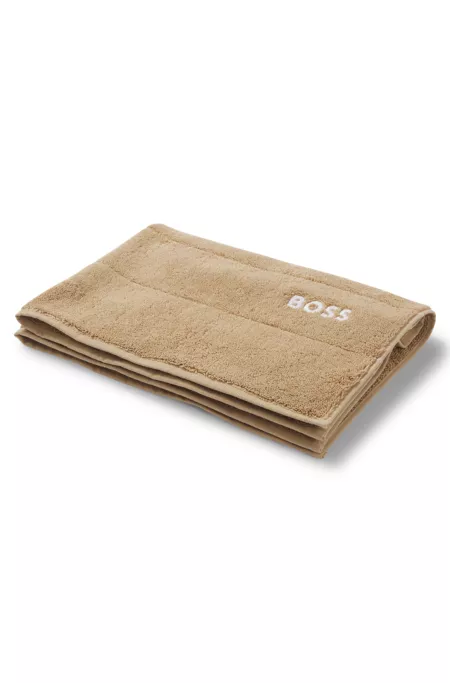 Cotton bath mat with contrast logo embroidery