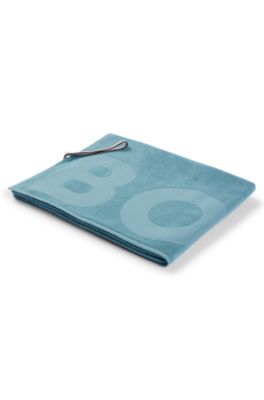 Cotton bath sheet with logo and signature-stripe strap, Turquoise