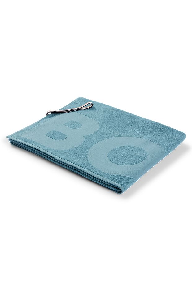 Cotton bath sheet with logo and signature-stripe strap, Turquoise