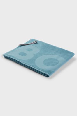 Cotton bath sheet with logo and signature-stripe strap, Turquoise