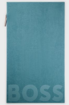 Cotton bath sheet with logo and signature-stripe strap, Turquoise