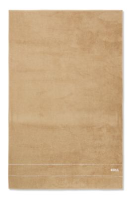 Badlakan i bomull med vit broderad logga, Beige