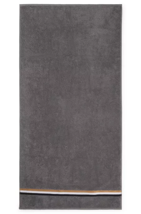 Cotton bath towel with signature-stripe border