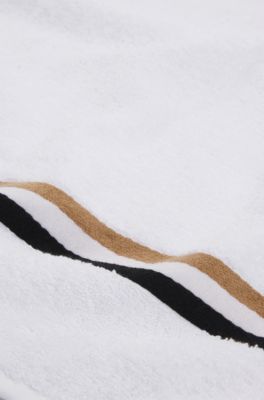 Cotton bath towel with signature-stripe border, White