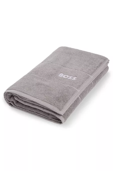 Cotton bath towel with white logo embroidery