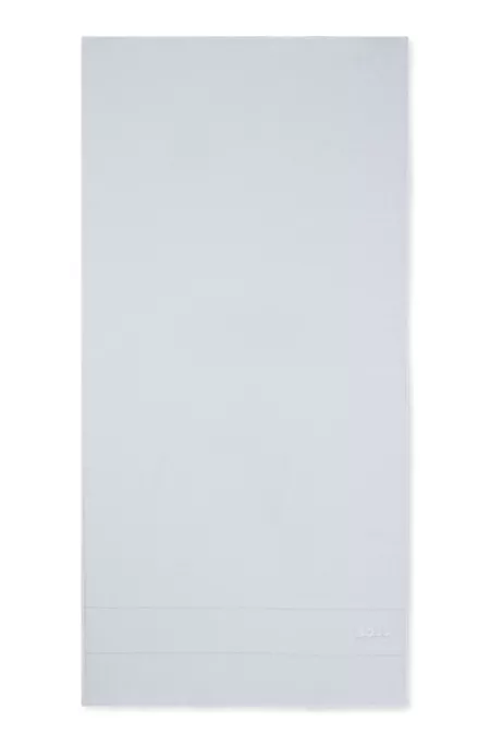 Cotton bath towel with white logo embroidery