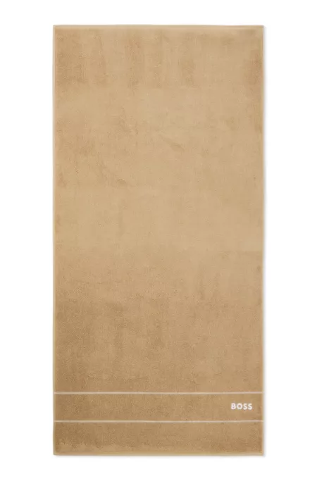 Cotton bath towel with white logo embroidery