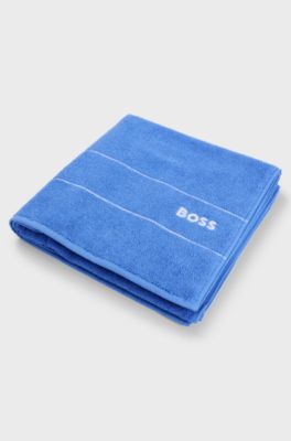 Serviette de bain en coton avec logo brod&eacute; blanc, Bleu