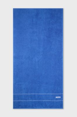 Serviette de bain en coton avec logo brod&eacute; blanc, Bleu