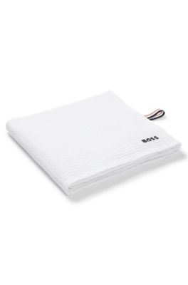 Honeycomb-cotton bath towel with signature-stripe strap, White