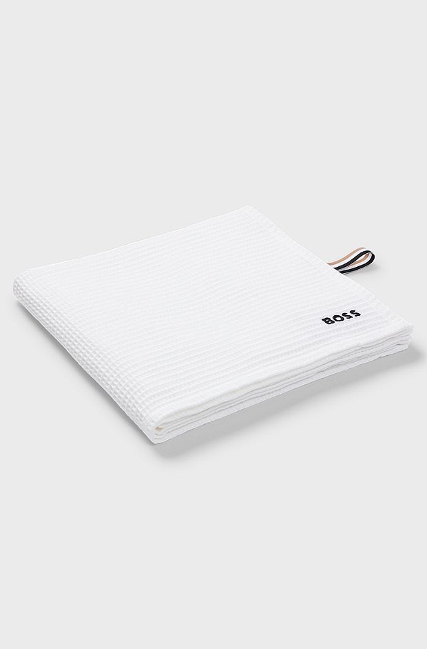 Honeycomb-cotton bath towel with signature-stripe strap, White