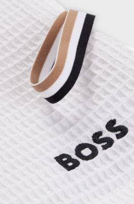 Honeycomb-cotton bath towel with signature-stripe strap, White