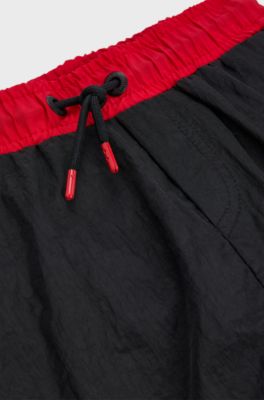 Kids' quick-dry swim shorts with vertical logo, Black