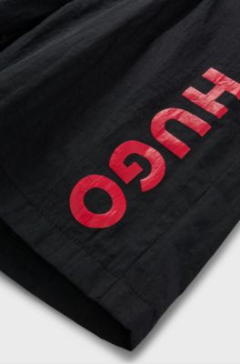 Kids' quick-dry swim shorts with vertical logo, Black