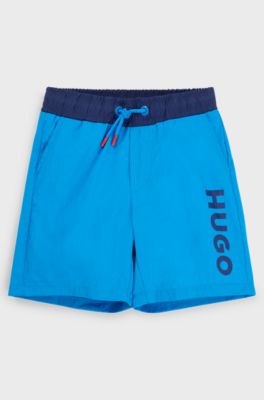 Kids' quick-dry swim shorts with vertical logo, Blue