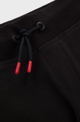 Kids' cotton-blend tracksuit bottoms with vertical logo print, Black
