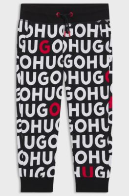 Kids' cotton-blend tracksuit bottoms with repeat-logo print, Patterned