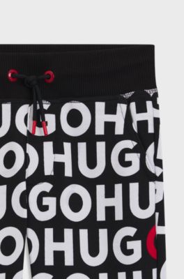 Kids' cotton-blend tracksuit bottoms with repeat-logo print, Patterned
