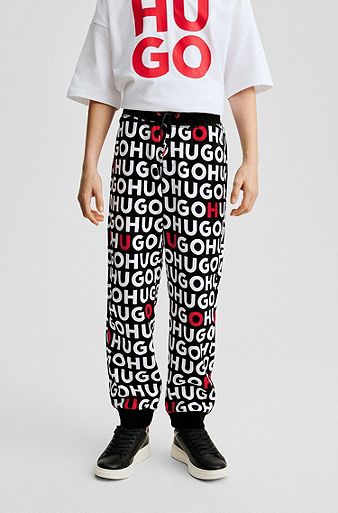 Kids' cotton-blend tracksuit bottoms with repeat-logo print, Patterned