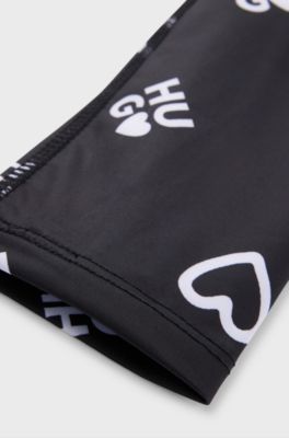 Leggings elasticizzati per bambini con stampa con cuori e logo, Nero
