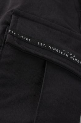 Kids' cargo trousers with branded pocket trims, Black