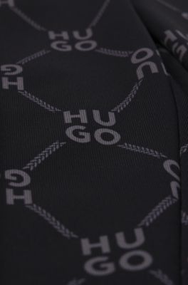 Pantalones de ch&aacute;ndal loose fit para ni&ntilde;os con logo apilado estampado, Negro estampado