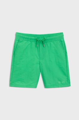 Kids-Badeshorts im Surfer-Look mit Logo-Print, Gr&uuml;n