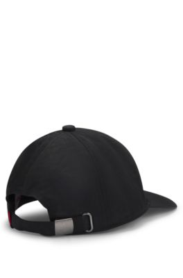 Cappellino per bambini in tessuto stropicciato con logo scomposto, Nero