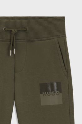 Tracksuit-bukser til b&oslash;rn i fleece af bomuldsblanding med delt logo, M&oslash;rkegr&oslash;n