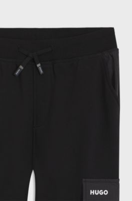 Kids' cotton-blend-fleece tracksuit bottoms with ripstop trims, Black