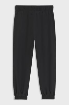 Pantaloni della tuta sportiva bambini con profili e logo, Nero