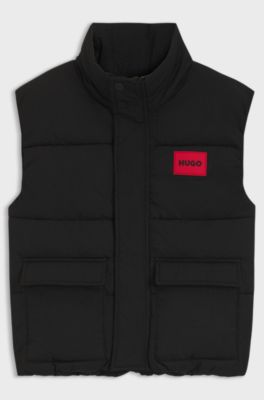 Kids' padded gilet with red logo badge, Black