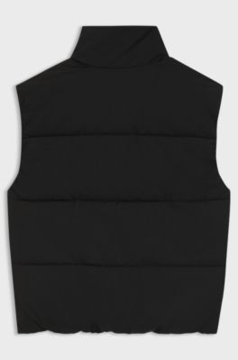 Kids' padded gilet with red logo badge, Black