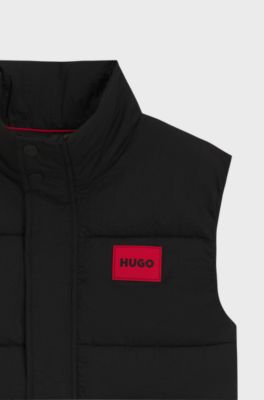 Kids' padded gilet with red logo badge, Black
