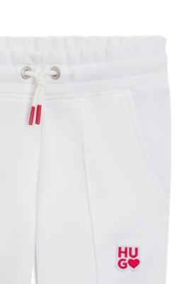 Kids' tracksuit bottoms in French terry with logo details, White