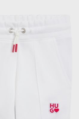Kids' tracksuit bottoms in French terry with logo details, White