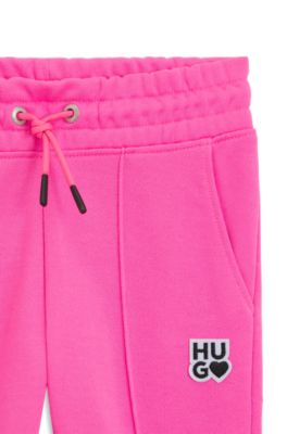Kids' fleece tracksuit bottoms with logo details, Pink