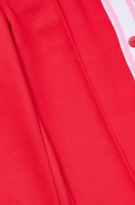 Pantaloni della tuta per bambini con bottoni automatici sulle cuciture laterali, Rosso