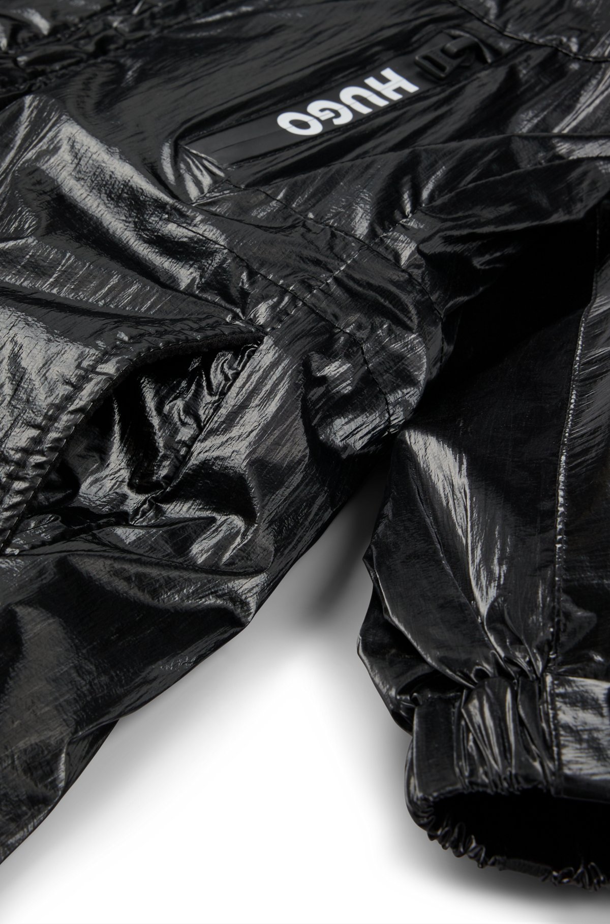 Kids' windbreaker in film-coated fabric with rear logo, Black