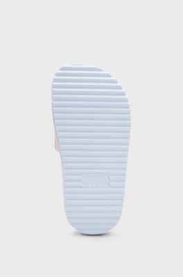 Kids' lightweight slides with handwritten-logo strap, light pink