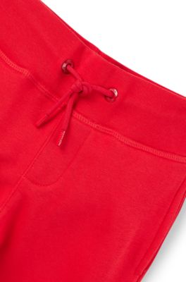 Kids' cotton-blend tracksuit bottoms with contrast logo, Red