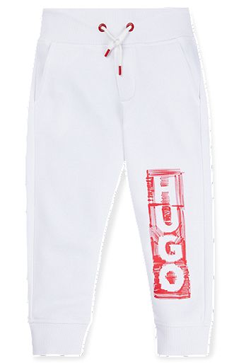 Kids' fleece tracksuit bottoms with marker-style logo, White