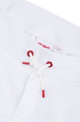 Kids' fleece tracksuit bottoms with marker-style logo, White