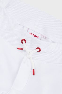 Kids' fleece tracksuit bottoms with marker-style logo, White