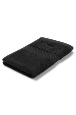 Cotton guest towel in black with embroidered logo, Black