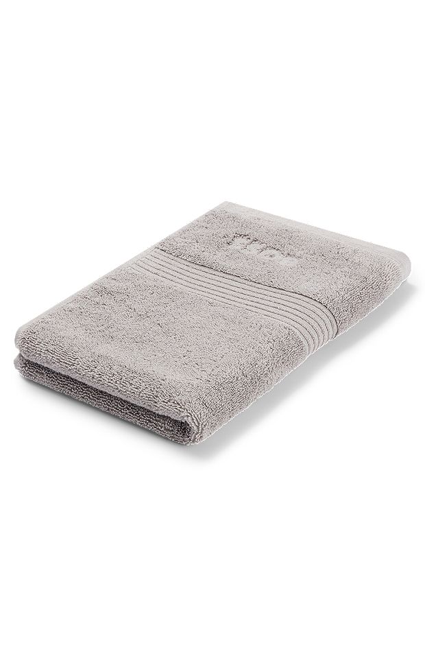 Asciugamano per ospiti in cotone egeo color argento con logo tono su tono, Argento