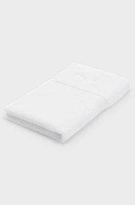 White cotton guest towel with embroidered logo, White