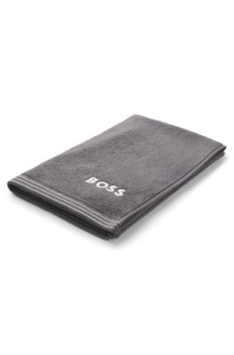 Cotton guest towel with contrast embroidered logo, Dark Grey