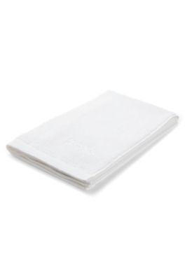 Cotton guest towel with contrast embroidered logo, White